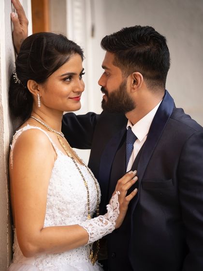 An intimate close-up of a Christian bride and groom. This photo captures the loving gaze and deep connection between the couple on their wedding day.