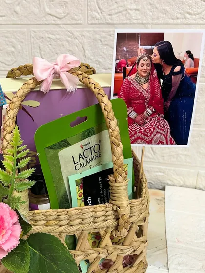 A close-up of the Rakhi hamper sent from Nepal, showing the personal photo and the mix of skincare products.