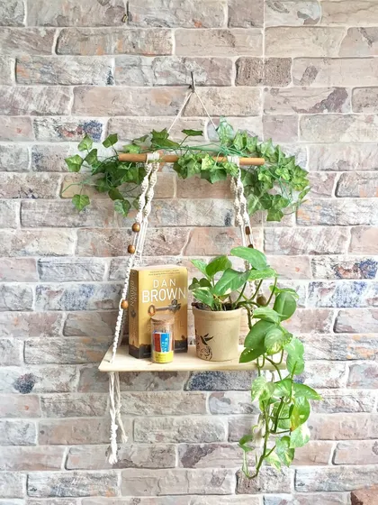 This is one of my favorite ways to use macrame. A simple hanging wall shelf adds so much life to a bare wall. It’s perfect for holding a small plant, a few books, or your favorite decorative items, bringing a touch of handmade warmth to your space.