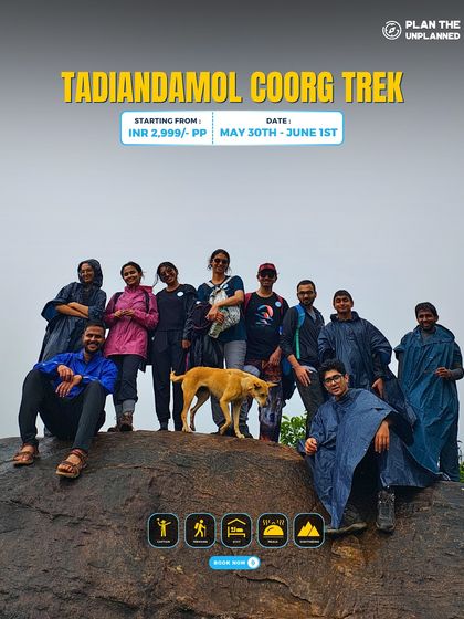 A group poses with a friendly dog on the Tadiandamol Coorg trek.