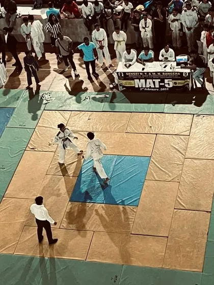 Two young Judokas compete on the mat during the championship. This is where training pays off, as students apply their knowledge of throws and grappling under pressure.