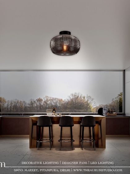 The same pendant as ID 52, but in a smoked glass finish. This creates a moodier, more dramatic statement of luxury and sophistication over the kitchen island.