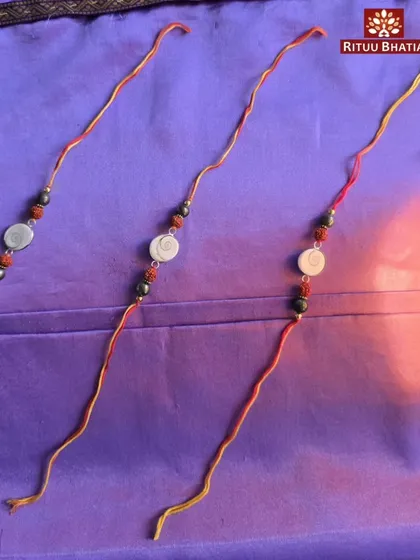 Here is a closer look at the energized Rakhis I have created for this Rakshabandhan. Each one is handcrafted with a Gomti Chakra, Rudraksha, and Pyrite to provide your brother with a powerful combination of blessings for prosperity, protection, and success. Limited pieces are available.