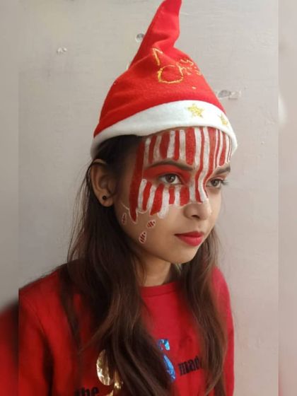 As part of a themed class, this student created a Christmas fantasy look. This candy cane-inspired face paint shows great control over line work and bold color application.