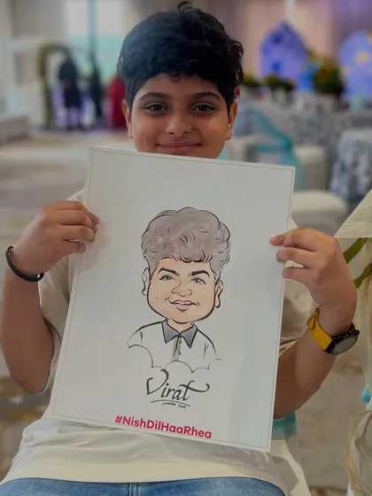 Even the youngest guests love getting their caricatures done. This young man was thrilled with his portrait at the wedding.