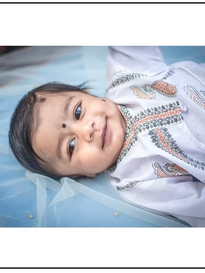A happy and content newborn looking right at the camera. I work patiently to capture these precious moments of eye contact.