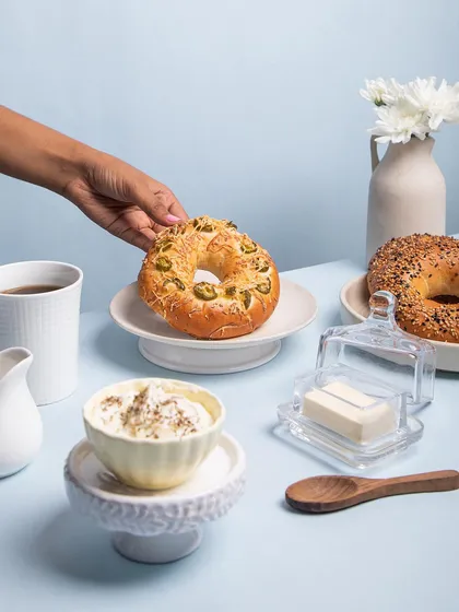 A classic breakfast setup featuring my freshly baked jalapeño cheese bagel and everything bagel, served with cream cheese.