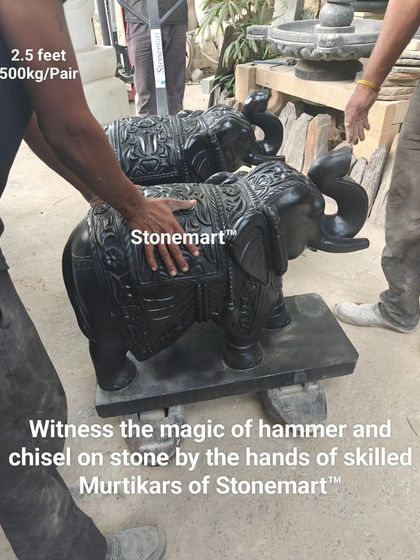 "Witness the magic of hammer and chisel." This image shows a pair of majestic, 2.5-foot black marble elephant statues, ready to adorn the entrance of a home, hotel, or resort.