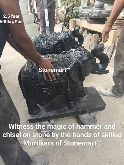 "Witness the magic of hammer and chisel." This image shows a pair of majestic, 2.5-foot black marble elephant statues, ready to adorn the entrance of a home, hotel, or resort.