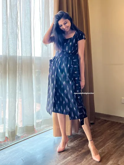 This black Ikat pinafore dress is a celebration of craftsmanship. Every thread tells a story of heritage, styled for today's woman.