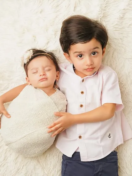 A more serious, protective pose from the big brother. It's wonderful to see the different facets of their new relationship emerge during a shoot.