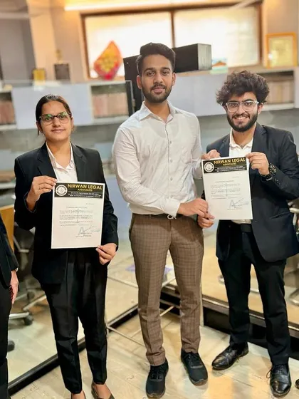 The team celebrates the interns' success. This moment captures the supportive environment we foster, where every achievement is a collective win.