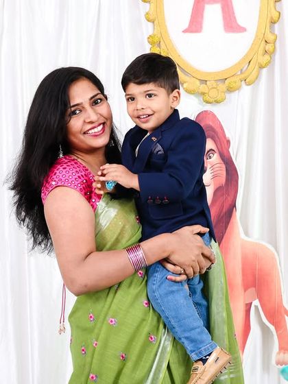 A happy mother and son portrait from a second birthday celebration.