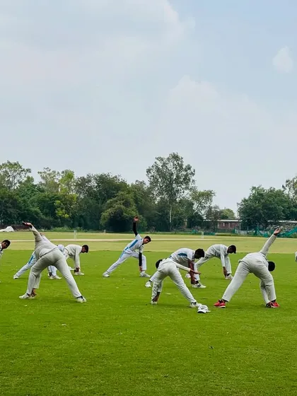 The team goes through a dynamic stretching routine. This helps in increasing blood flow and preparing muscles for intense action.