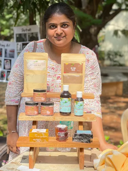 This is me, the Madurai ponnu behind Kailash Skin Care, at an alumnae meet at my college. I'm so proud to stand by the products I create, from my De-Tan packs and hair oils to my handmade soaps.