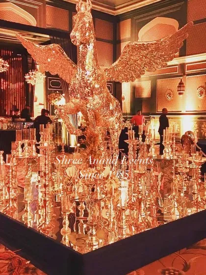 For a touch of fantasy and pure opulence, we design unique statement pieces like this golden, crystal-encrusted winged horse. It’s this kind of imaginative decor that makes our events truly unforgettable.