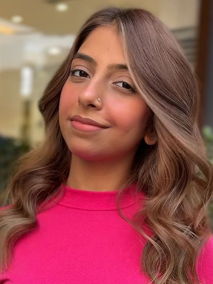 A close-up of the 'money piece' highlights from the classic transformation. The bright blonde strands frame the face beautifully, creating a youthful and radiant effect.