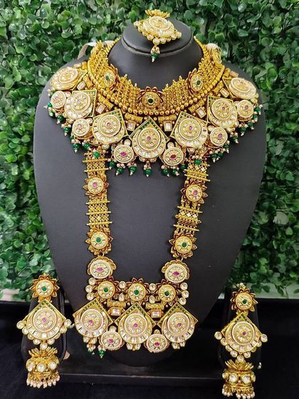 A full view of a grand bridal set from my exclusive sale collection. The intricate design features multiple layers, combining kundan, polki, and colored stones for a truly regal effect.