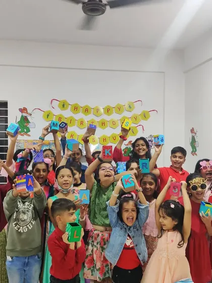 So much excitement! These partygoers are thrilled with the colorful pen stands they designed and painted all by themselves during a birthday celebration.