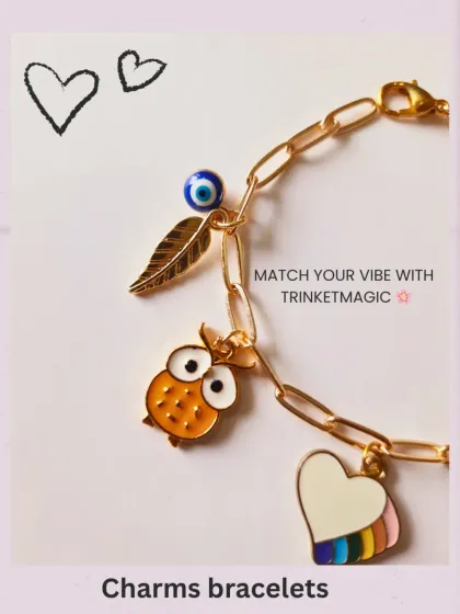 A detailed shot focusing on the owl, rainbow heart, and evil eye charms on a custom bracelet. Each charm is carefully placed to create a balanced and meaningful design.