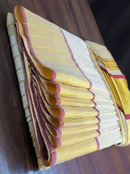 A different angle showing the neatly box-folded saree, highlighting how the pleats are preserved.