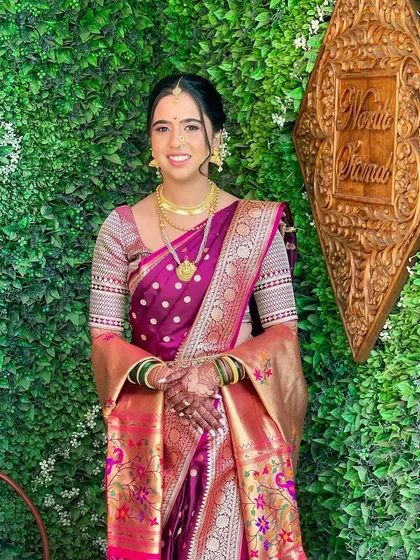 A full-length view of Ramaa's beautiful Paithani saree and her elegant, minimal styling.
