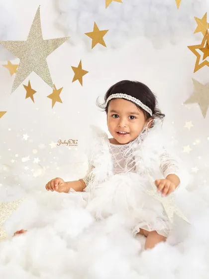 A sweet and gentle portrait amidst the clouds. This theme is so versatile and creates a serene and beautiful atmosphere.