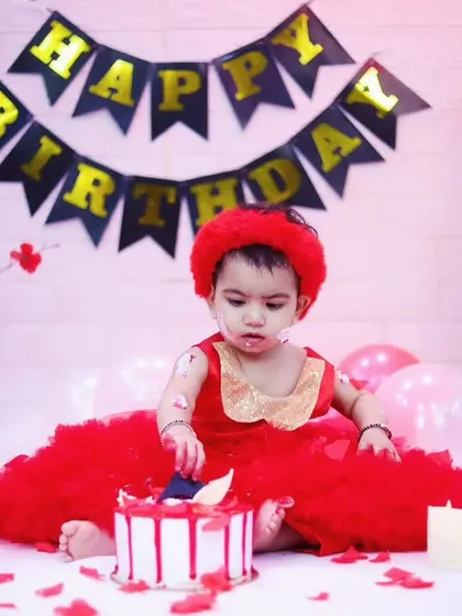 The cake smash is officially underway. We love capturing the moment they first touch the cake.