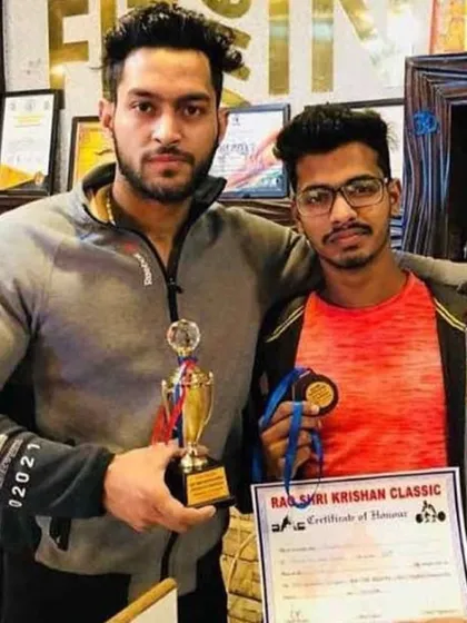 Celebrating another victory with a dedicated client. The trophy and medal are proof of the hard work put in. As your coach, I guide you through the entire transformation journey.