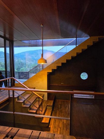 Navigating a hilly terrain requires a thoughtful approach to transitions. The staircases at Villa Soham are designed as open, flowing elements that connect levels while maintaining a constant visual relationship with the mountain view.