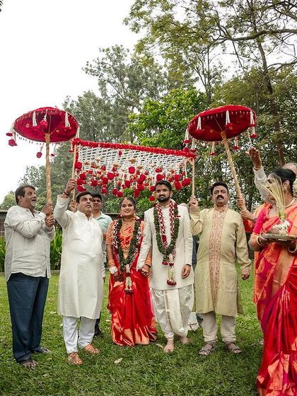 The bride and groom's procession, with family members creating a path of welcome and celebration.