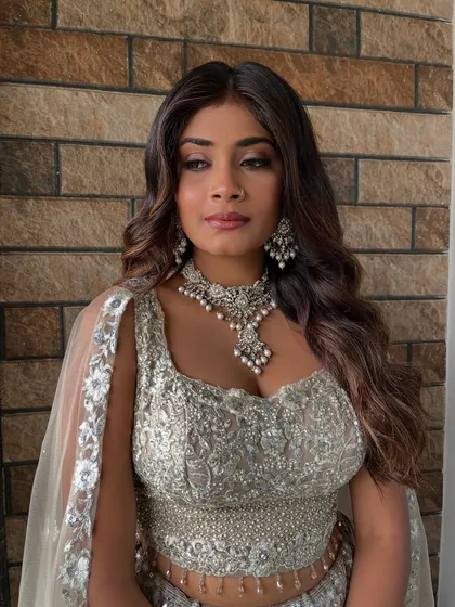 The final look against a textured background, showing how the makeup appears in different lighting. The soft glam style remains consistent, radiant, and picture-perfect.