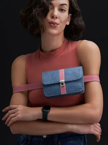 A fun and quirky shot from the A Big Indian Story campaign. The unique arm-band styling of the bag shows its versatility and modern design.