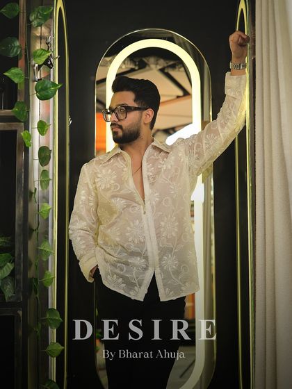 A look of modern romance. The delicate, sheer fabric combined with the floral embroidery creates a shirt that is both strong and soft, a duality I explore in my designs.