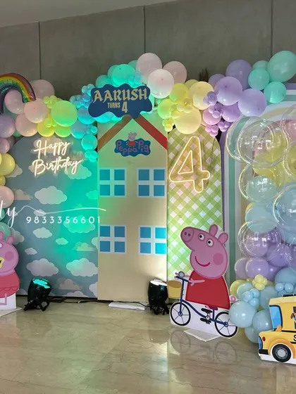 A full view of the Peppa Pig setup, showing all the character standees and backdrop elements.