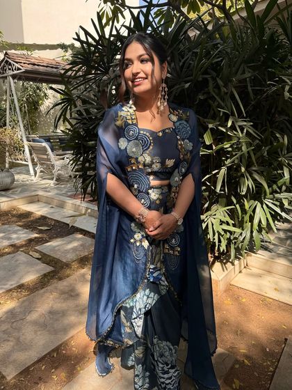 The art of makeup in its purest form. This look features a messy ponytail with gold leaf accents, paired with a glowing, natural base for a daytime event.