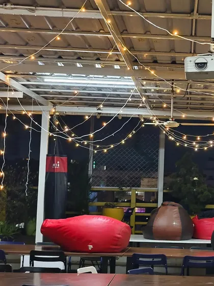 We made sure the entire recreational area at the Bizom office was part of the festive fun. This view shows the lighting above the casual seating area with bean bags and a projector, making it a perfect spot for an office holiday movie screening.