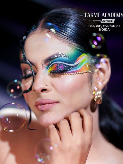 An artistic shot with bubbles, adding a whimsical touch to this creative eye makeup look.