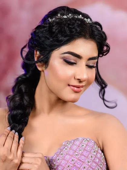 Achieving that 'glass skin' finish is my specialty. This close-up shows a dewy, luminous complexion with soft, shimmery eyeshadow for a dreamy, ethereal look perfect for beauty portraits.