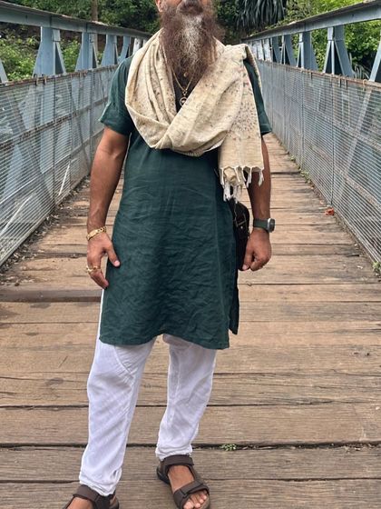 Standing on a wooden bridge during a retreat. Bridges symbolize connection, just as yoga connects the body, mind, and spirit.