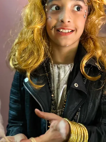 A rockstar ghost with a big smile, enjoying the party atmosphere. The costumes and makeup are always top-notch.