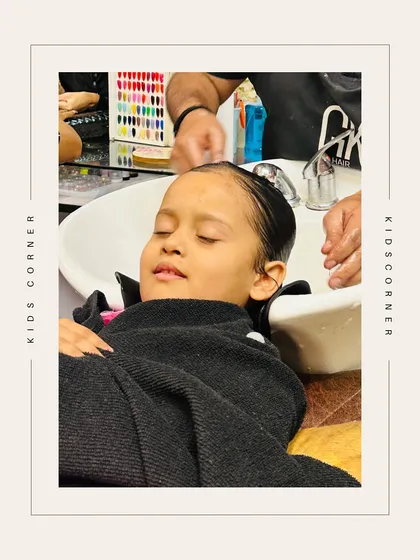 Another shot of a child enjoying a relaxing hair wash, showing that even the little ones can enjoy a bit of pampering.