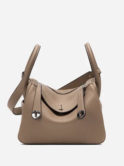 A clean, studio-style front view of the Linde Large bag. This image clearly shows the bag's symmetrical design, handles, and hardware.