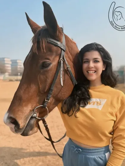 A rider and horse pose for a photo, both looking happy and relaxed in each other's company.