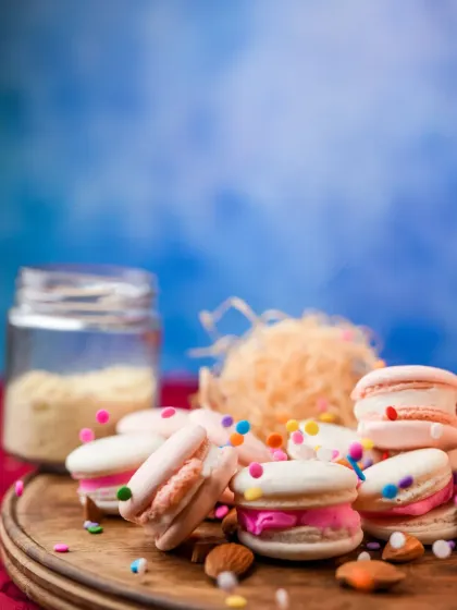 A playful shot of our macarons with sprinkles falling over them, capturing the fun and joy our desserts bring.