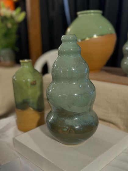 A few of my favorite finished vases from a recent collection, featuring a variety of glazes, painted details, and forms. Each one has its own personality.