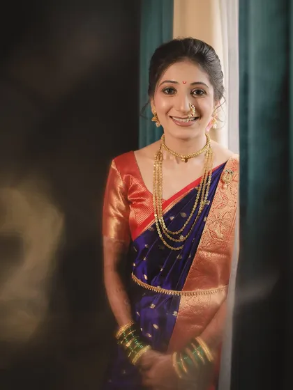 A candid shot of my bride Aditi, her smile lighting up the room. Her natural and radiant makeup highlights her happiness on her special day.