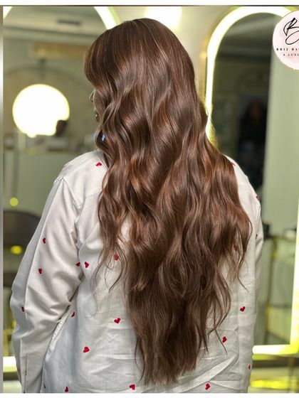 A final look at the side profile, where the luminous brown waves frame the face beautifully.