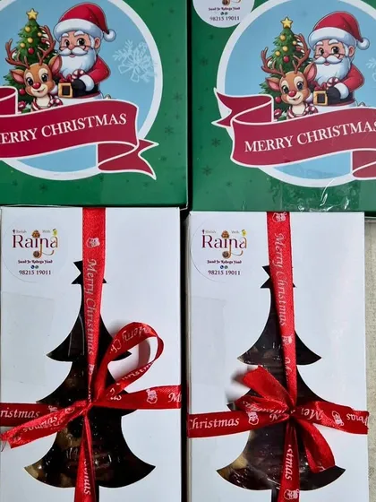 A variety of my Christmas packaging options, from festive Santa boxes to elegant tree-shaped window boxes, all tied with beautiful ribbons.