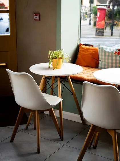 A quiet, cozy corner in a cafe, perfect for a rainy day. Photos like this sell an atmosphere, making people want to visit the space, not just eat the food.